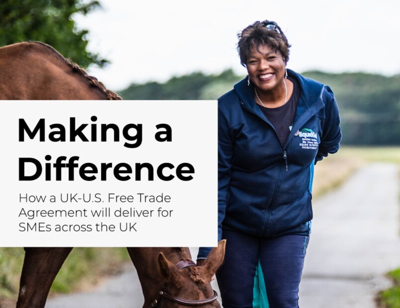 Woman standing with a horse