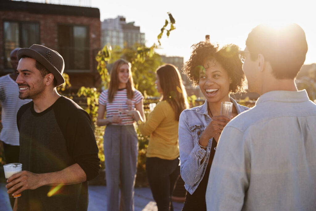 Young adults talking on rooftop