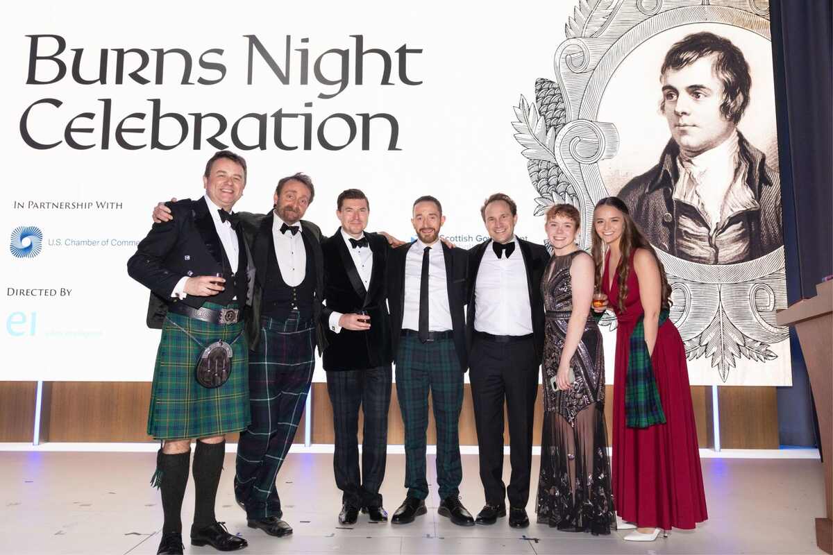 Several people standing on stage