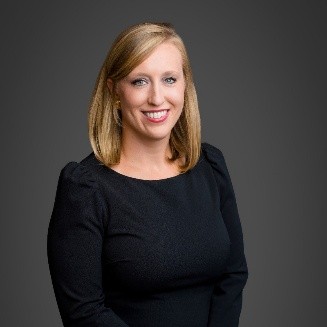 Blond woman in black shirt.